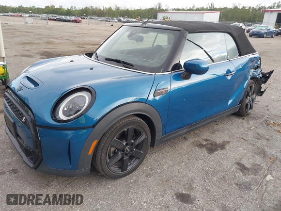2022 MINI Convertible Cooper S z VIN WMW43DL06N3P19784, wystawiony jako IAAI lot #42635816 z przebiegiem 17 053 mil mil oraz . Historia ofert i sprzedaży dostępna na DreamBid. Obrazek 18.