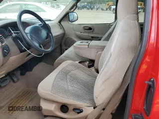1999 Ford F-150 with VIN 1FTZX1725XNA33332, listed as a Copart auction lot 51867455 with 163,023 mi miles and Salvage title. Bid and sale history available at DreamBid. Image 7.