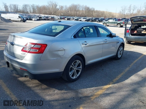 2013 Ford Taurus SEL with VIN 1FAHP2E8XDG191132, listed as a IAAI auction lot 41833542 with 165,125 mi miles. Bid and sale history available at carsss.com. Image 4.