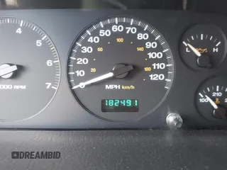 2004 Jeep Grand Cherokee with VIN 1J4GX48J74C283123, listed as a IAAI auction lot 42477393 with 182,491 mi miles and . Bid and sale history available at DreamBid. Image 7.