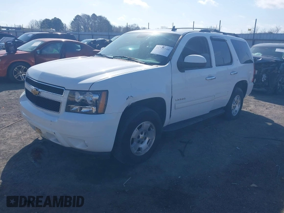 2014 Chevrolet Tahoe LT with VIN 1GNSCBE06ER233105, listed as a IAAI auction lot 41753190 with 161,056 mi miles and . Bid and sale history available at DreamBid. Image 19.