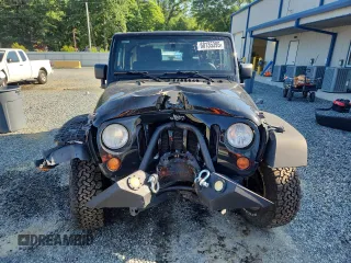 2012 Jeep Wrangler Sport with VIN 1C4AJWAG5CL273292, listed as a Copart auction lot 60135395 with 123,874 mi miles and Salvage title. Bid and sale history available at DreamBid. Image 5.