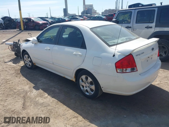 2009 Kia Spectra EX with VIN KNAFE221X95624138, listed as a IAAI auction lot 41823611 with 136,790 mi miles. Bid and sale history available at carsss.com. Image 3.