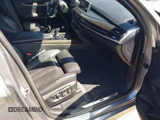 2014 BMW X5 xDrive50i with VIN 5UXKR6C57E0J72301, listed as a IAAI auction lot 39379887 with 117,012 mi miles. Bid and sale history available at carsss.com. Image 5.