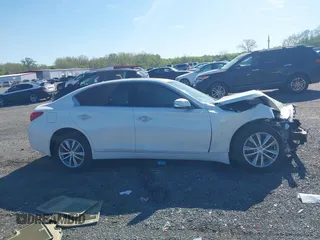 2015 Infiniti Q50 z VIN JN1BV7AR9FM413538, wystawiony jako IAAI lot #42115540 z przebiegiem 116 620 mil mil oraz . Historia ofert i sprzedaży dostępna na DreamBid. Obrazek 13.