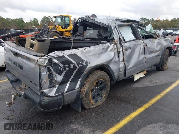 2021 Ram 1500 Rebel with VIN 1C6SRFLT0MN734774, listed as a IAAI auction lot 41075676 with 95,808 mi miles and . Bid and sale history available at DreamBid. Image 4.