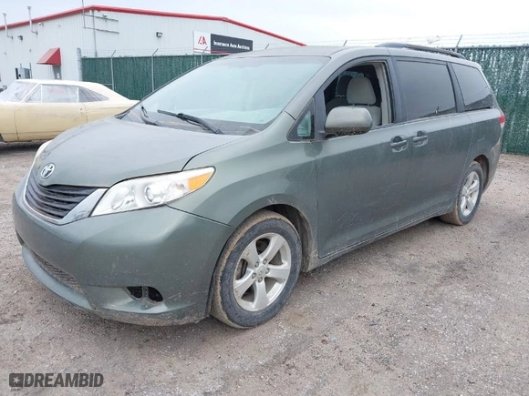 2011 Toyota Sienna LE AAS with VIN 5TDKK3DCXBS119702, listed as a IAAI auction lot 41954050 with 214,873 mi miles. Bid and sale history available at carsss.com. Image 2.