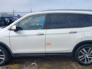 2017 Honda Pilot Touring with VIN 5FNYF6H95HB094641, listed as a IAAI auction lot 41531652 with 97,615 mi miles. Bid and sale history available at carsss.com. Image 6.