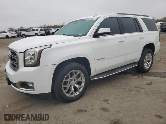 2015 GMC Yukon SLE with VIN 1GKS1AKC8FR733084, listed as a Copart auction lot 82960064 with 163,576 mi miles and Salvage Title. Bid and sale history available at carsss.com. Image 1.