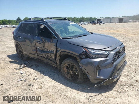 2023 Toyota RAV4 Hybrid XSE with VIN 2T3E6RFV9PW039963, listed as a Copart auction lot 57594335 with 27,486 mi miles and Salvage title. Bid and sale history available at DreamBid. Image 4.