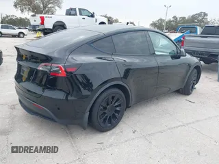 2021 Tesla Model Y Standard Range with VIN 5YJYGDED8MF123246, listed as a IAAI auction lot 41291676 with 74,630 mi miles and . Bid and sale history available at DreamBid. Image 4.