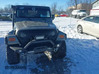 2004 Jeep Wrangler Sahara with VIN 1J4FA59S94P731123, listed as a IAAI auction lot 41288284 with 138,515 mi miles and . Bid and sale history available at DreamBid. Image 12.
