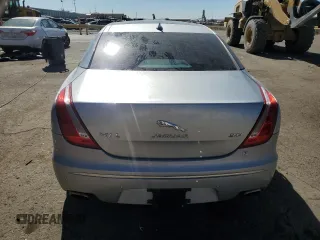 2014 Jaguar XJ Portfolio with VIN SAJWA2GZ2E8V70065, listed as a Copart auction lot 43872505 with 138,677 mi miles and Salvage title. Bid and sale history available at DreamBid. Image 6.