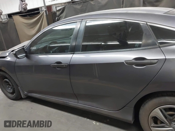 2020 Honda Civic LX with VIN 19XFC2F67LE006057, listed as a IAAI auction lot 42032759 with 119,319 mi miles and . Bid and sale history available at DreamBid. Image 15.
