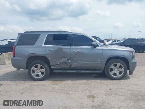 2019 Chevrolet Tahoe LT z VIN 1GNSCBKC8KR406519, wystawiony jako IAAI lot #42145021 z przebiegiem 74 694 mil mil oraz . Historia ofert i sprzedaży dostępna na DreamBid. Obrazek 13.
