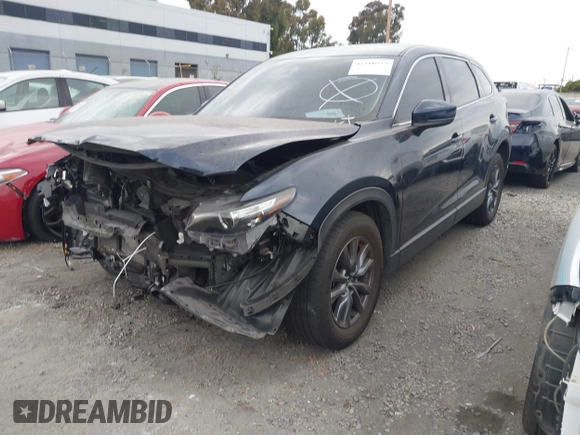 2021 Mazda CX-9 Touring with VIN JM3TCACY9M0526880, listed as a IAAI auction lot 42310923 with 25,991 mi miles and . Bid and sale history available at DreamBid. Image 2.