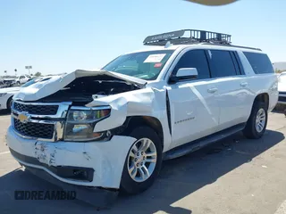 2019 Chevrolet Suburban LT with VIN 1GNSCHKC3KR143942, listed as a IAAI auction lot 41896633 with 153,139 mi miles and . Bid and sale history available at DreamBid. Image 2.