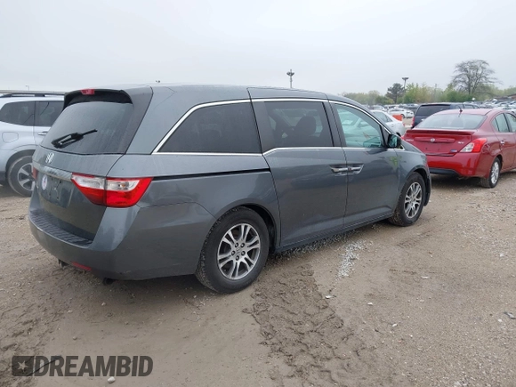 2013 Honda Odyssey EX z VIN 5FNRL5H47DB032096, wystawiony jako IAAI lot #42149190 z przebiegiem 149 836 mil mil oraz . Historia ofert i sprzedaży dostępna na DreamBid. Obrazek 4.