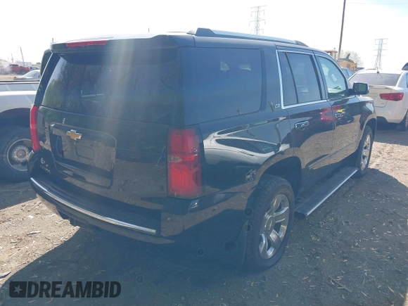 2015 Chevrolet Tahoe LTZ z VIN 1GNSKCKC8FR141163, wystawiony jako IAAI lot #42114008 z przebiegiem 221 804 mil mil oraz . Historia ofert i sprzedaży dostępna na DreamBid. Obrazek 4.
