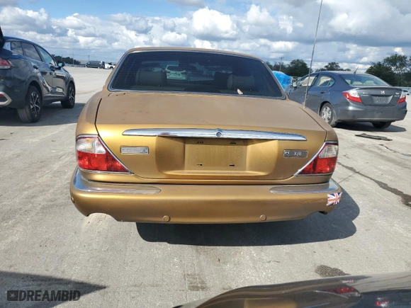 2001 Jaguar XJ with VIN SAJDA14C81LF27992, listed as a Copart auction lot 73808614 with 71,749 mi miles and Salvage Title. Bid and sale history available at carsss.com. Image 6.