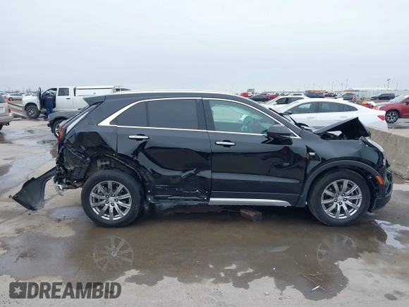 2020 Cadillac XT4 AWD Premium Luxury z VIN 1GYFZDR47LF122394, wystawiony jako IAAI lot #41703115 z przebiegiem 69 366 mil mil oraz . Historia ofert i sprzedaży dostępna na DreamBid. Obrazek 13.