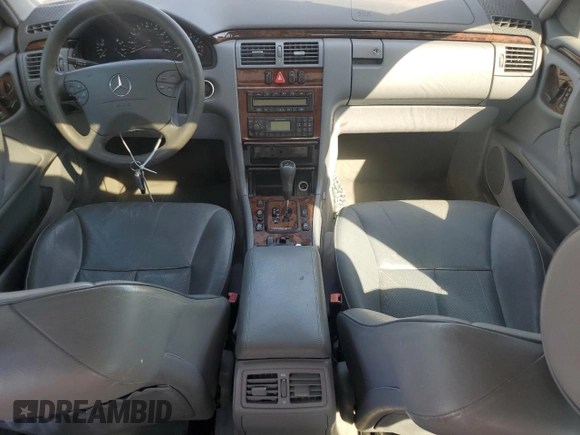 2000 Mercedes-Benz E-Class with VIN WDBJF70JXYB091085, listed as a Copart auction lot 77136484 with 185,429 mi miles and Salvage Title. Bid and sale history available at carsss.com. Image 8.
