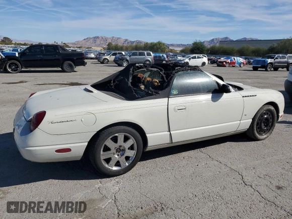 2003 Ford Thunderbird Deluxe z VIN 1FAHP60A83Y113992, wystawiony jako Copart lot #77277574 z przebiegiem Nie podano mil oraz Nie do naprawy • Non repairable. Historia ofert i sprzedaży dostępna na DreamBid. Obrazek 3.
