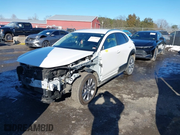 2022 Mazda CX-30 S Select z VIN 3MVDMBBL8NM448787, wystawiony jako IAAI lot #41577914 z przebiegiem 64 552 mil mil oraz . Historia ofert i sprzedaży dostępna na DreamBid. Obrazek 2.