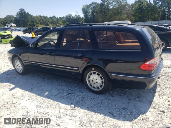 2001 Mercedes-Benz E-Class AWD with VIN WDBJH82J91X057063, listed as a Copart auction lot 70235274 with 174,846 mi miles and Salvage Title. Bid and sale history available at carsss.com. Image 2.