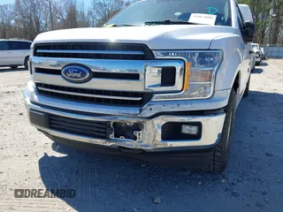 2018 Ford F-150 XL with VIN 1FTFX1C57JKF08037, listed as a IAAI auction lot 41863806 with 195,725 mi miles and . Bid and sale history available at DreamBid. Image 6.