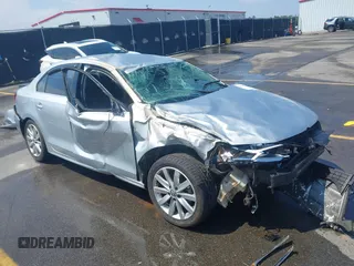 2013 Volkswagen Jetta SE z VIN 3VWDX7AJXDM455340, wystawiony jako IAAI lot #42198360 z przebiegiem 31 024 mil mil oraz . Historia ofert i sprzedaży dostępna na DreamBid. Obrazek 1.