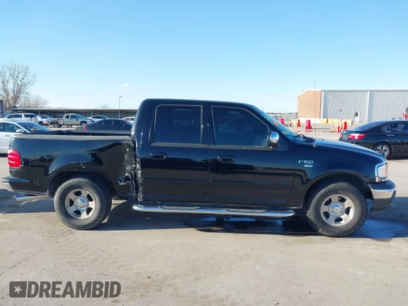 2002 Ford F-150 XLT with VIN 1FTRW07622KD31203, listed as a IAAI auction lot 41401506 with 166,949 mi miles. Bid and sale history available at carsss.com. Image 13.