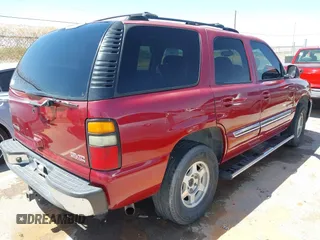 2004 GMC Yukon SLT with VIN 1GKEK13Z44R301456, listed as a IAAI auction lot 42056635 with 196,799 mi miles. Bid and sale history available at carsss.com. Image 4.