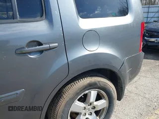 2011 Honda Pilot EX-L with VIN 5FNYF4H51BB065906, listed as a IAAI auction lot 41956370 with 233,977 mi miles and . Bid and sale history available at DreamBid. Image 18.