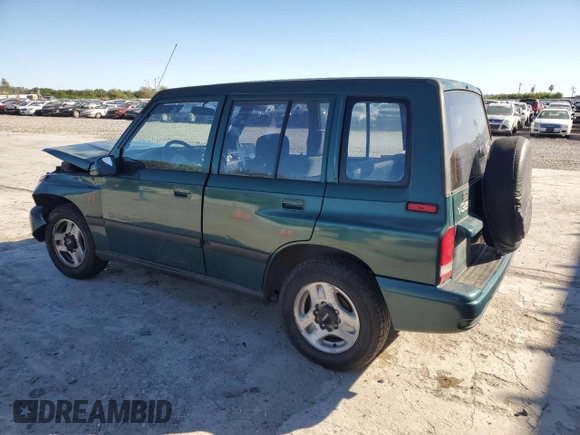 1996 Geo Tracker z VIN 2CNBE1363T6921541, wystawiony jako Copart lot #81647384 z przebiegiem 61 806 mil mil oraz Szkoda całkowita • Salvage title. Historia ofert i sprzedaży dostępna na DreamBid. Obrazek 2.