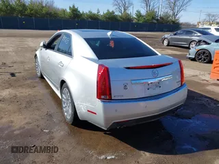 2013 Cadillac CTS Premium with VIN 1G6DP5E39D0100975, listed as a IAAI auction lot 41915113 with 110,436 mi miles and . Bid and sale history available at DreamBid. Image 3.