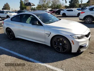 2015 BMW M4 with VIN WBS3R9C55FK330561, listed as a Copart auction lot 40490133 with 65,127 mi miles. Bid and sale history available at carsss.com. Image 4.