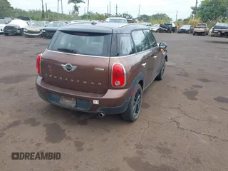 2014 MINI Countryman with VIN WMWZB3C51EWR36737, listed as a IAAI auction lot 41741248 with 69,717 mi miles and . Bid and sale history available at DreamBid. Image 4.