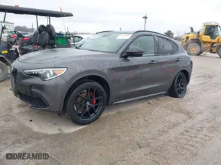 2021 Alfa Romeo Stelvio Ti with VIN ZASPAKBN9M7D18770, listed as a IAAI auction lot 41520181 with 64,709 mi miles. Bid and sale history available at carsss.com. Image 2.