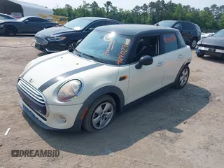 2015 MINI Hardtop 4 Door with VIN WMWXS5C5XFT827330, listed as a IAAI auction lot 42402965 with 140,648 mi miles and . Bid and sale history available at DreamBid. Image 2.