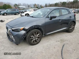 2016 Mazda CX-3 Grand Touring with VIN JM1DKBD72G0103803, listed as a Copart auction lot 82769204 with 91,727 mi miles and Salvage Title. Bid and sale history available at carsss.com. Image 1.