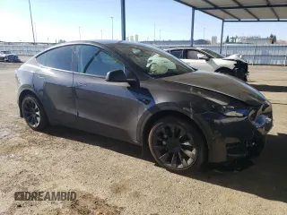 2024 Tesla Model Y Long Range with VIN 7SAYGDEE4RF127409, listed as a Copart auction lot 84274794 with 14,246 mi miles and Salvage title. Bid and sale history available at DreamBid. Image 4.