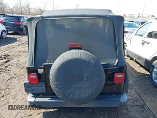 2002 Jeep Wrangler X with VIN 1J4FA39S52P770664, listed as a IAAI auction lot 41661580 with 122,445 mi miles. Bid and sale history available at carsss.com. Image 16.