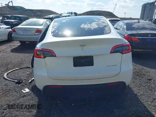 2023 Tesla Model Y Long Range with VIN 7SAYGDEE4PF780951, listed as a IAAI auction lot 41856461 with 63,317 mi miles. Bid and sale history available at carsss.com. Image 16.
