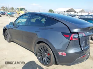 2023 Tesla Model Y Performance with VIN 7SAYGDEF5PF823122, listed as a IAAI auction lot 41546480 with 12,943 mi miles and . Bid and sale history available at DreamBid. Image 3.