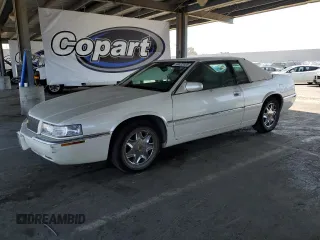 2000 Cadillac Eldorado z VIN 1G6EL12Y0YU150610, wystawiony jako Copart lot #59422035 z przebiegiem 109 724 mil mil oraz Czysty tytuł • Clean title. Historia ofert i sprzedaży dostępna na DreamBid. Obrazek 1.