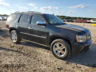 2010 Chevrolet Tahoe LTZ with VIN 1GNUKCE00AR105129, listed as a Copart auction lot 72955014 with 197,431 mi miles and Salvage title. Bid and sale history available at DreamBid. Image 4.