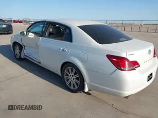 2008 Toyota Avalon XL with VIN 4T1BK36BX8U318365, listed as a IAAI auction lot 41857162 with 166,196 mi miles. Bid and sale history available at carsss.com. Image 3.