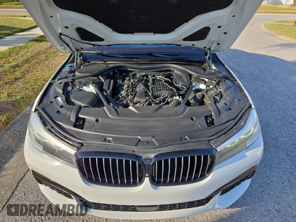 2017 BMW 7 Series 740i with VIN WBA7E2C54HG740427, listed as a Copart auction lot 54992345 with 93,252 mi miles and Clean Title. Bid and sale history available at carsss.com. Image 7.
