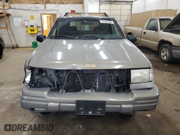 1996 Jeep Grand Cherokee Limited z VIN 1J4GZ78S5TC210710, wystawiony jako Copart lot #81307904 z przebiegiem 285 169 mil mil oraz Szkoda całkowita • Salvage title. Historia ofert i sprzedaży dostępna na DreamBid. Obrazek 5.